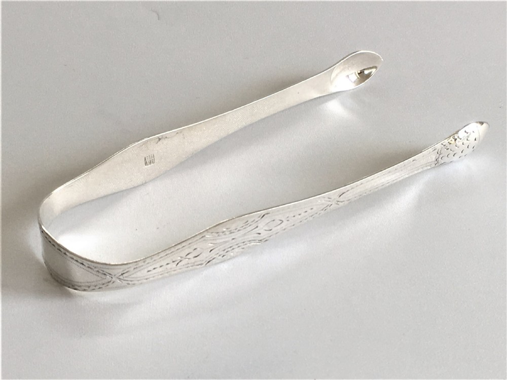 A gorgeous pair of 18th Century silver tongs View VI