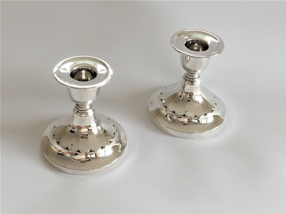 A good pair of third height silver candlesticks