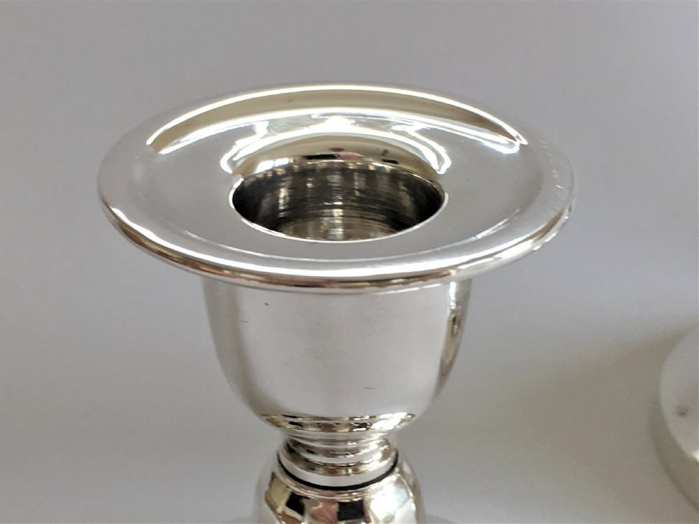 A good pair of third height silver candlesticks View III