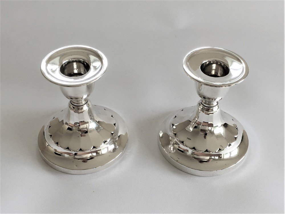 A good pair of third height silver candlesticks View VII