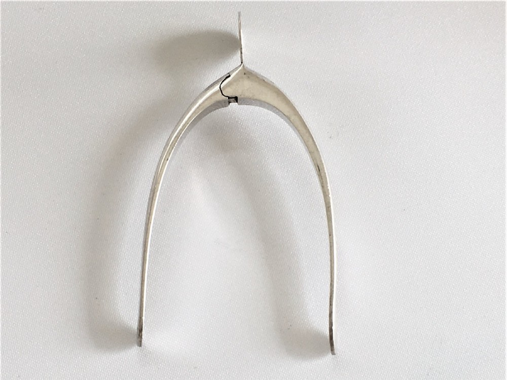 A pair of novelty silver sprung wishbone tongs View II