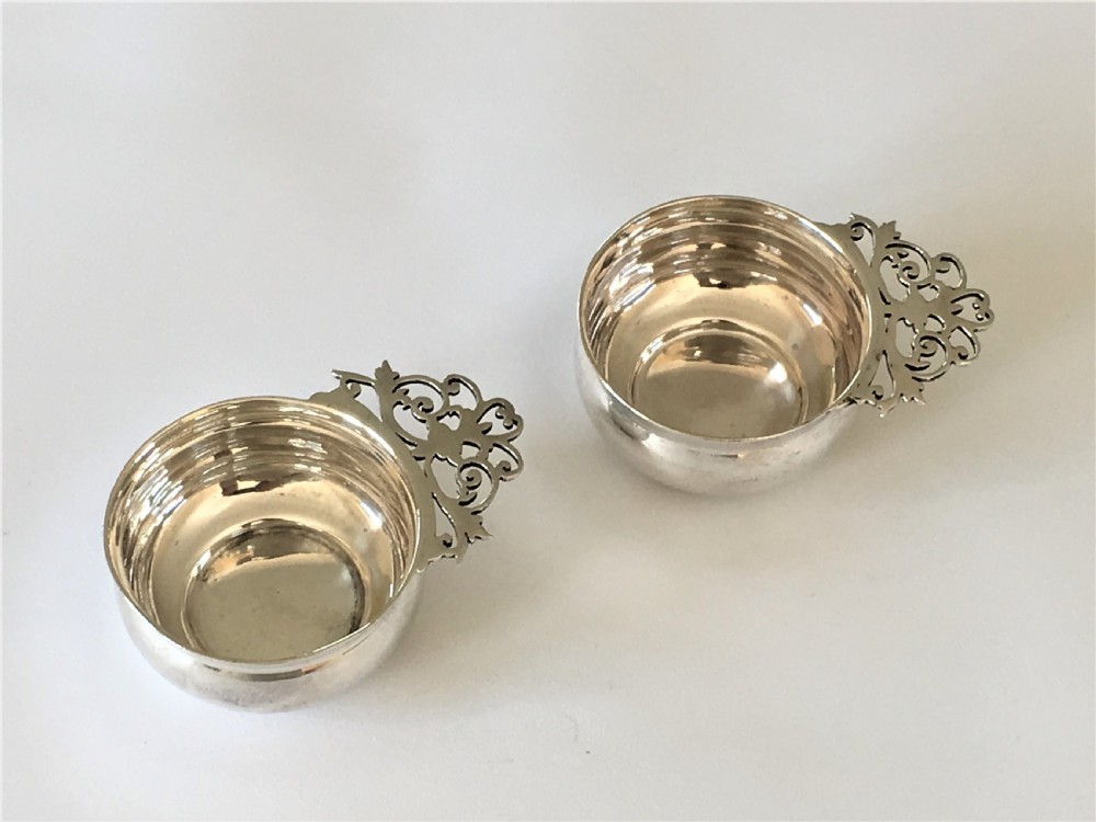 A pair of small silver Whisky tasters View II