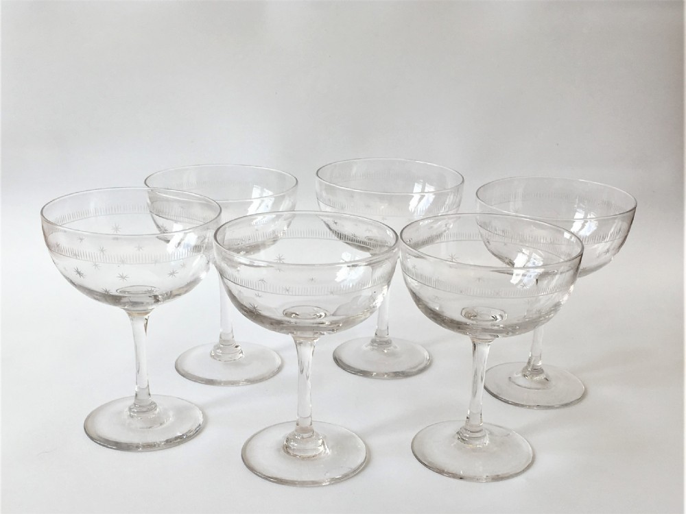A set of six star etched champagne glasses