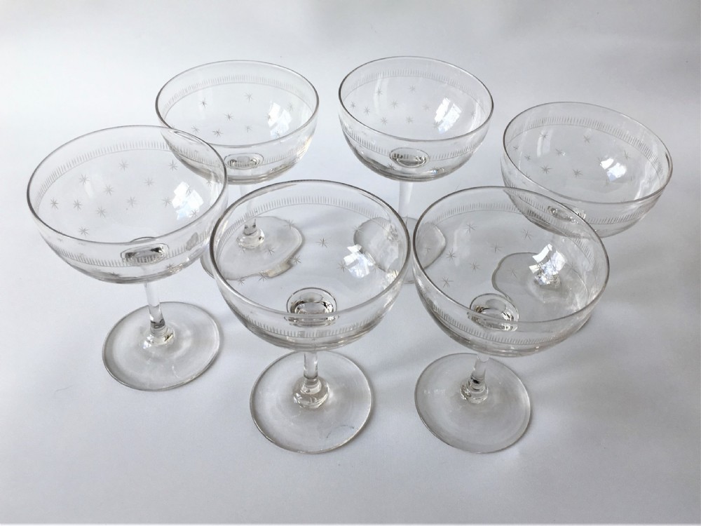 A set of six star etched champagne glasses View II