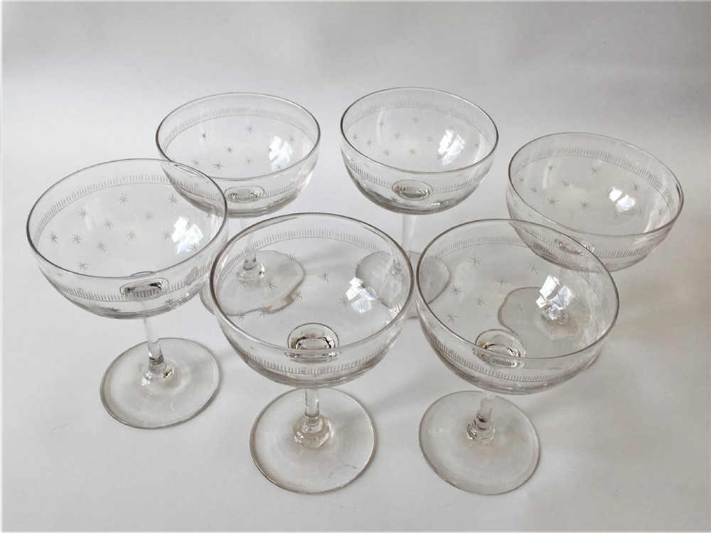 A set of six star etched champagne glasses View IV