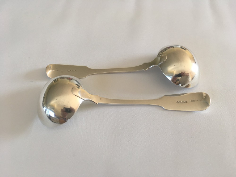 A fine pair of Victorian silver gravy ladles View III