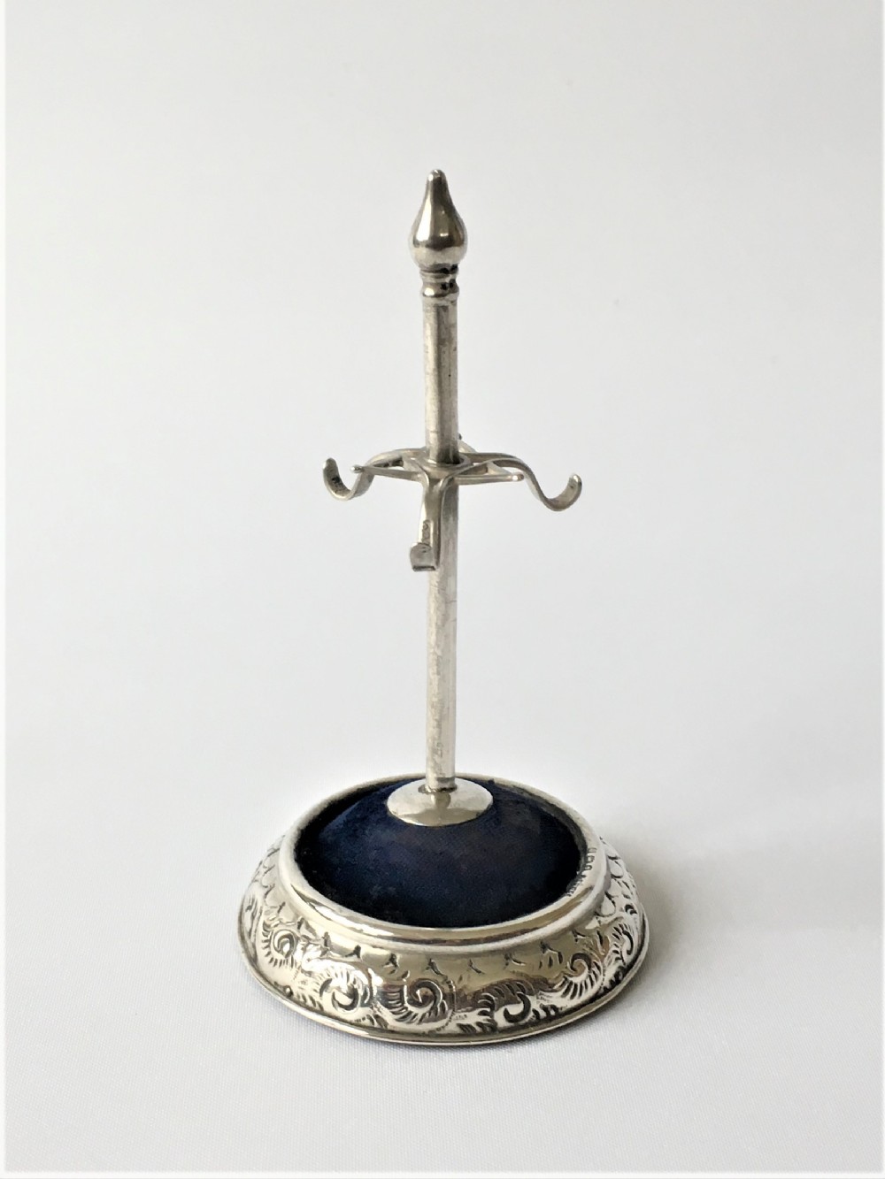 A collectable Edwardian silver hatpin/ring stand