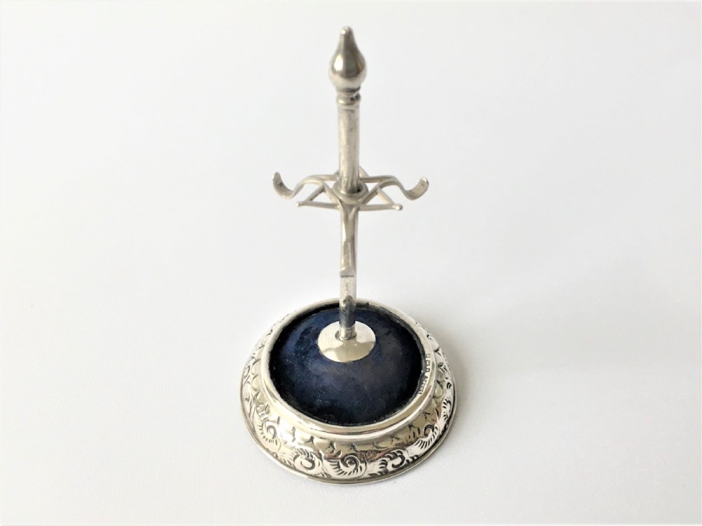 A collectable Edwardian silver hatpin/ring stand View II
