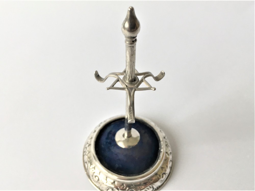 A collectable Edwardian silver hatpin/ring stand View IV