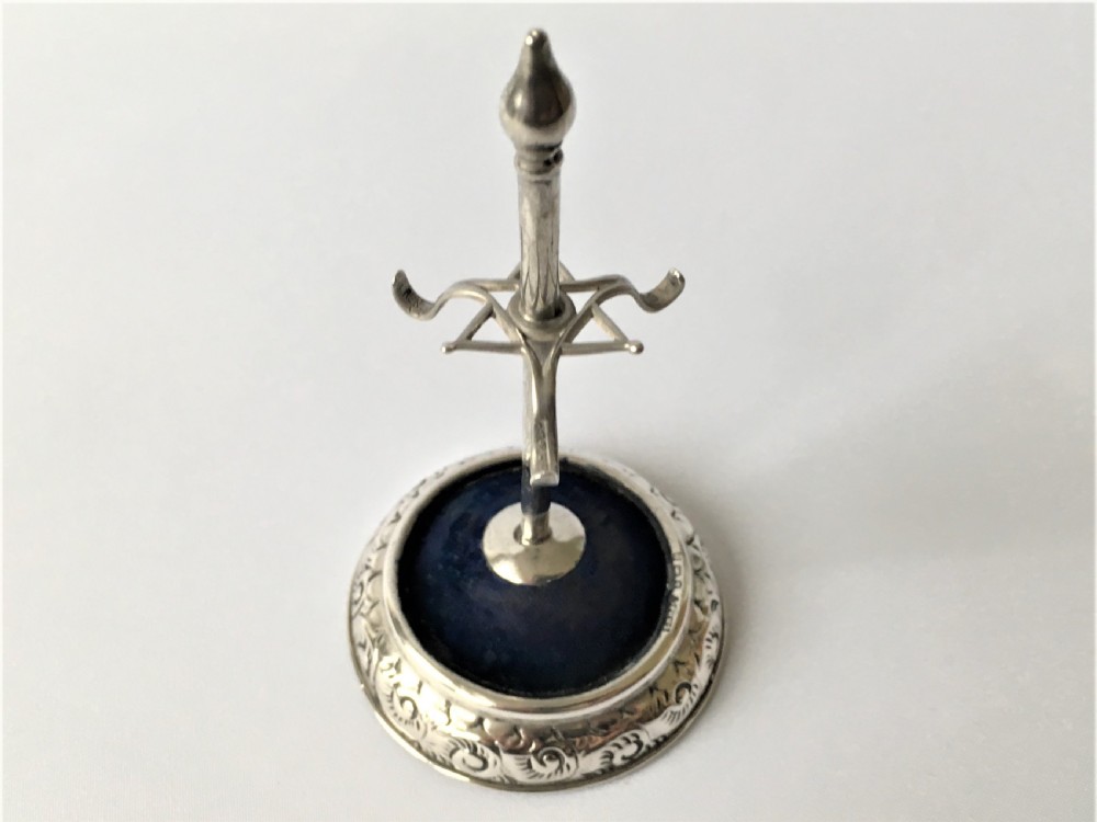 A collectable Edwardian silver hatpin/ring stand View V