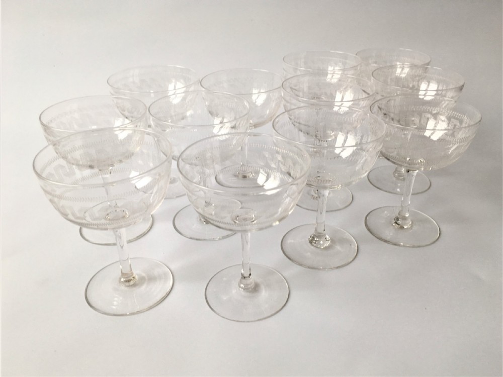 A fine set of 12 Greek Key etched champagne bowls View II