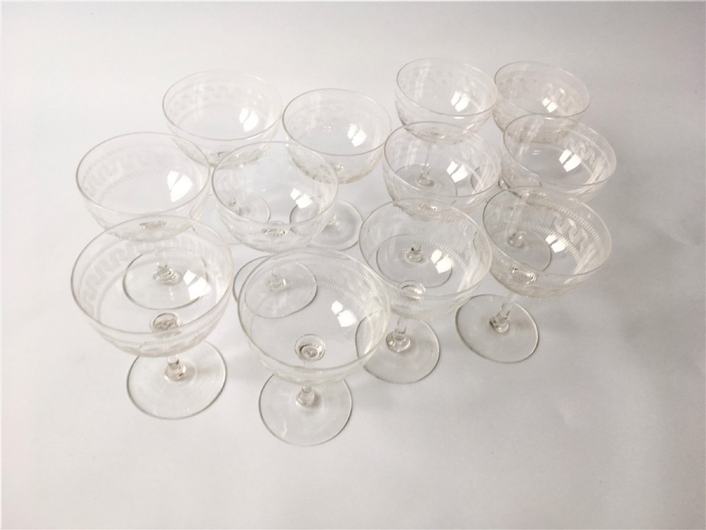 A fine set of 12 Greek Key etched champagne bowls View III