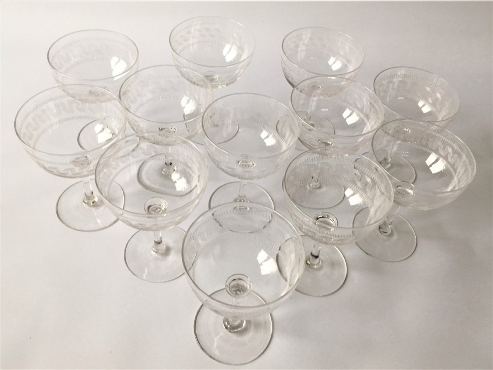 A fine set of 12 Greek Key etched champagne bowls View VII