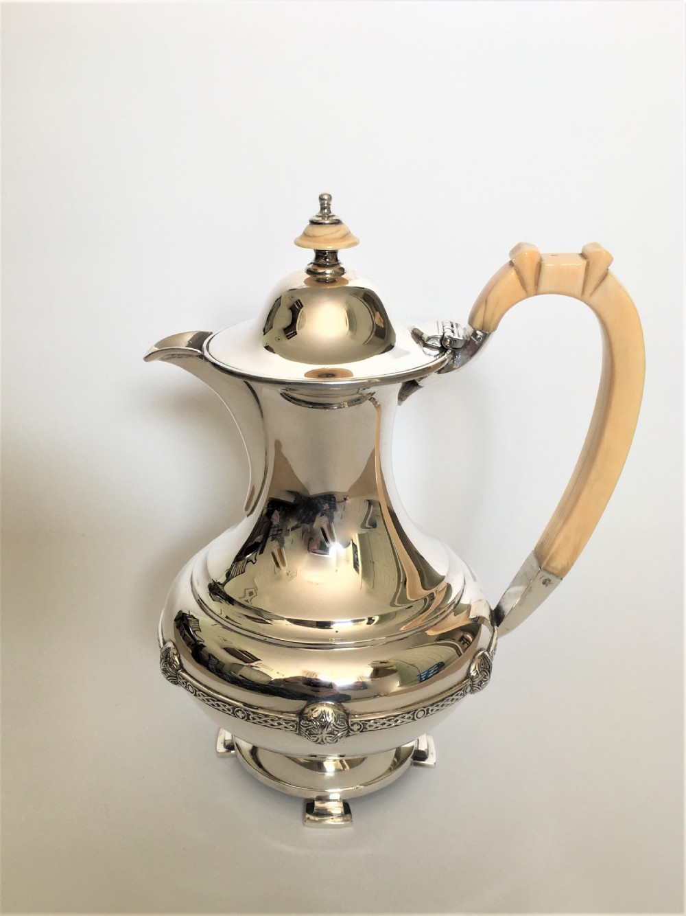 A superb Arts & Crafts silver coffee pot/hot water jug