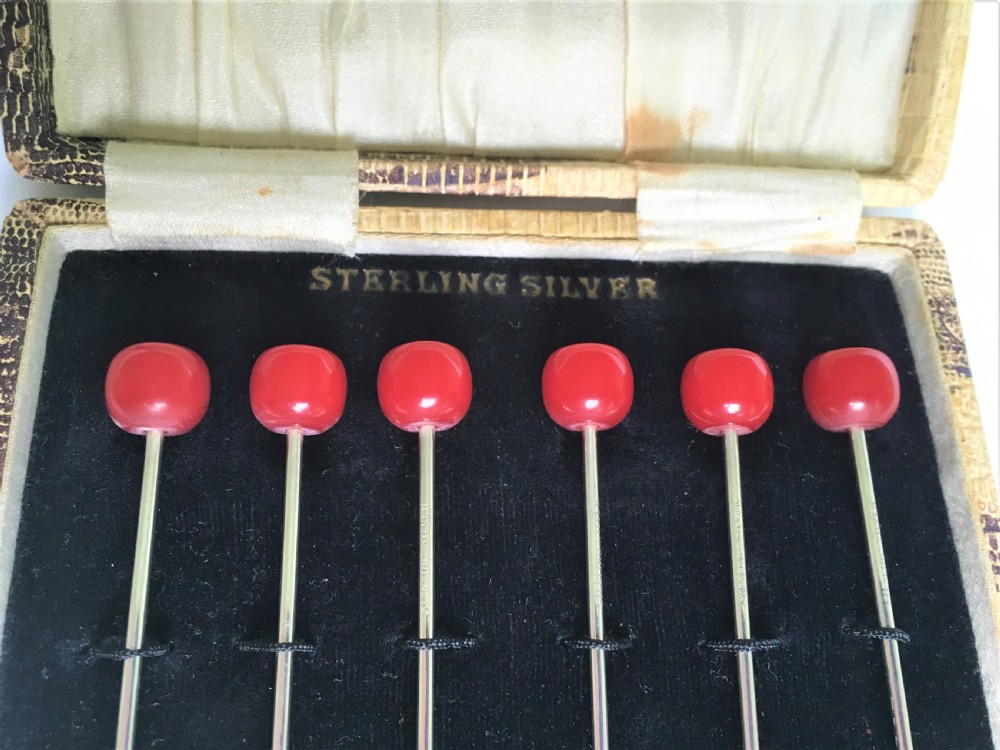 A charming set of six Sterling silver 'cherry' cocktail sticks View V