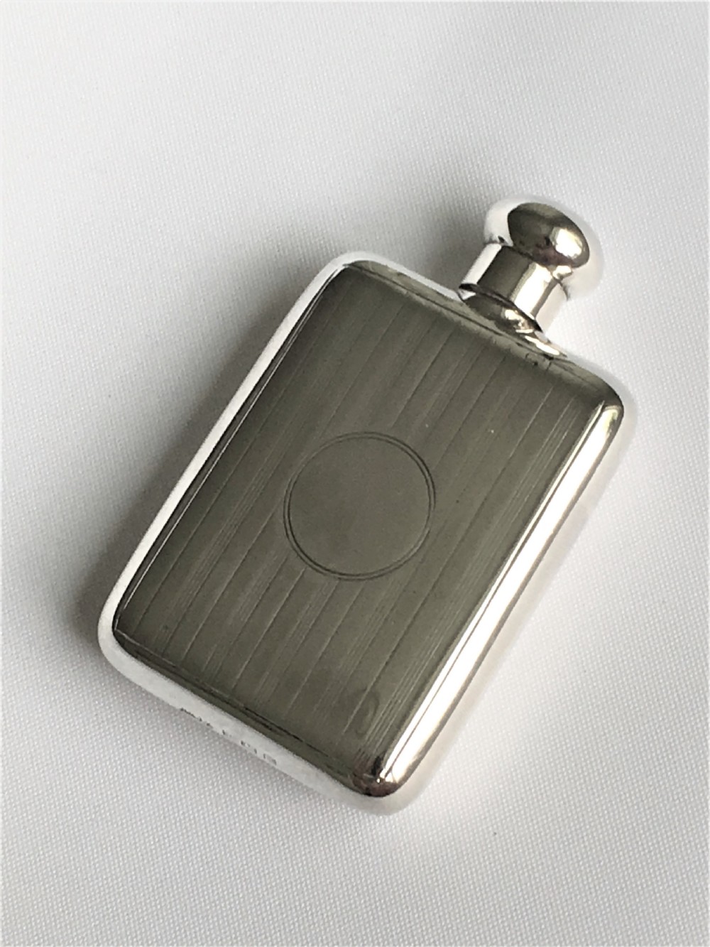 A novelty 'hip flask' silver scent bottle