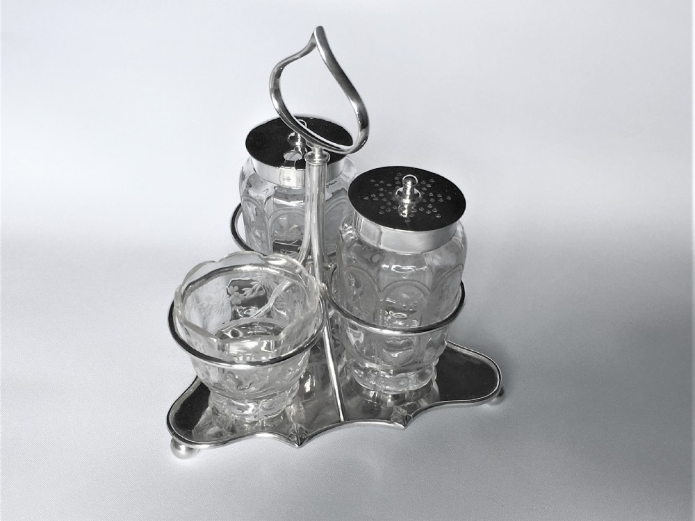 An attractive Edwardian silver three piece cruet set View III