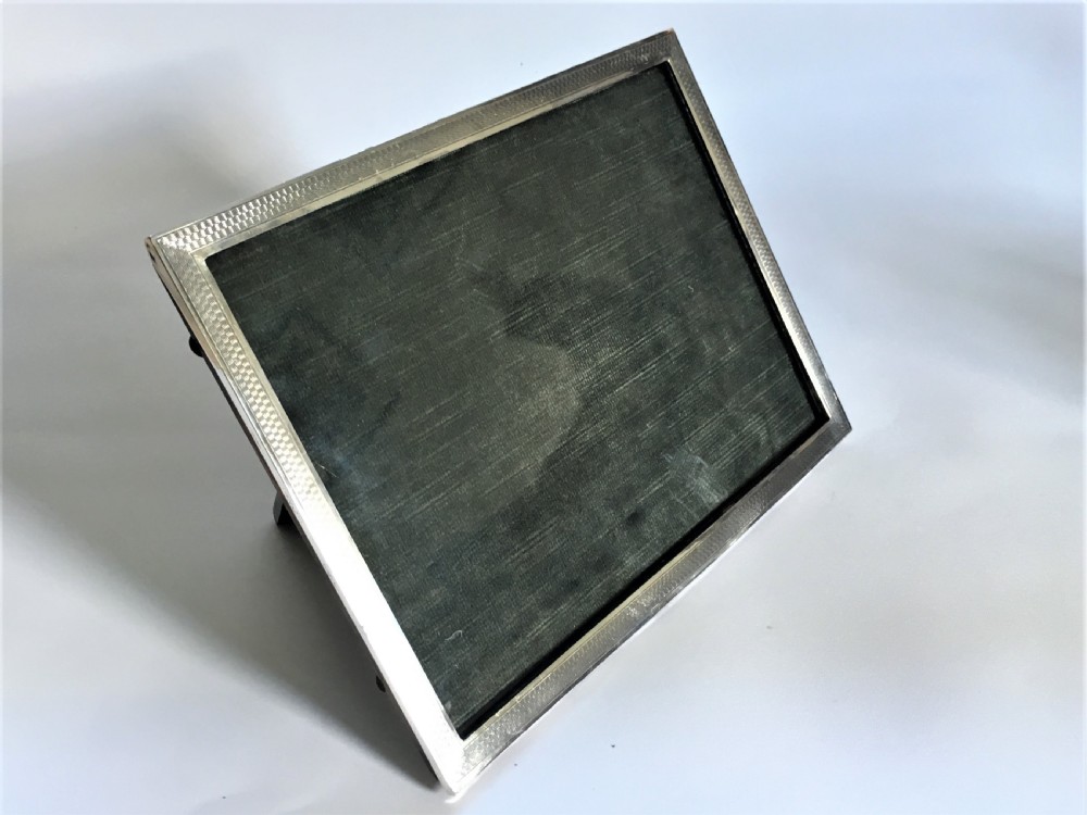 An Art Deco silver landscape/portrait photo frame