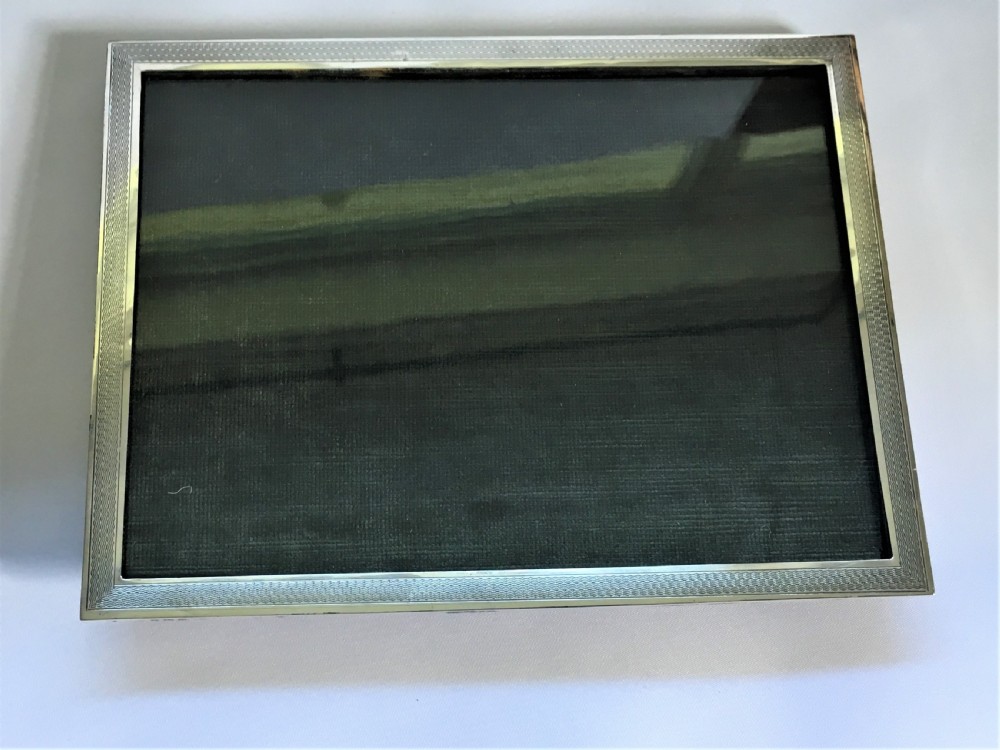 An Art Deco silver landscape/portrait photo frame View IV