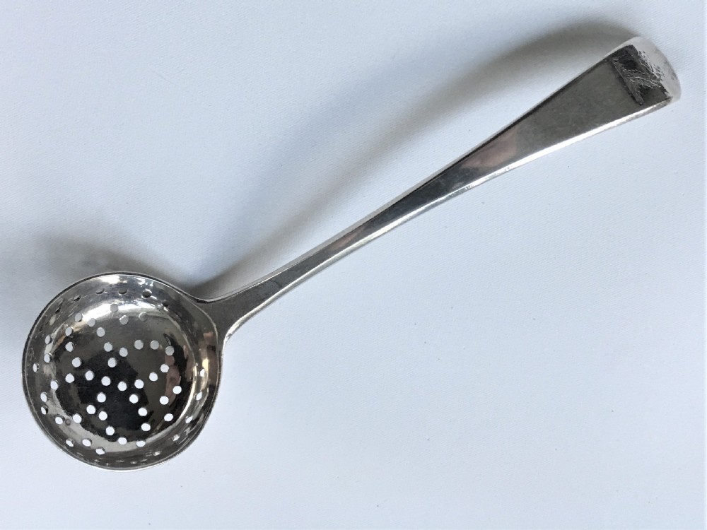 A rare Georgian silver spice sifting ladle