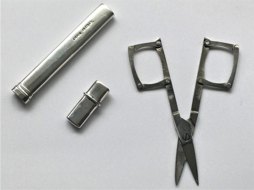 A rare pair of silver cased folding campaign scissors