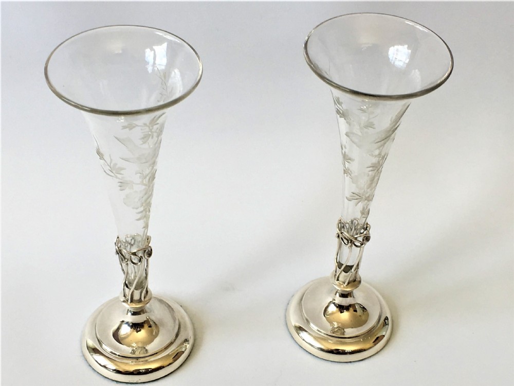 A lovely pair of William Comyns silver bud vases