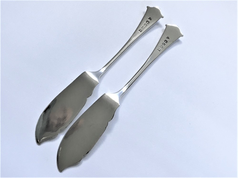A delightful pair of Onslow pattern Victorian silver butter knives  View III