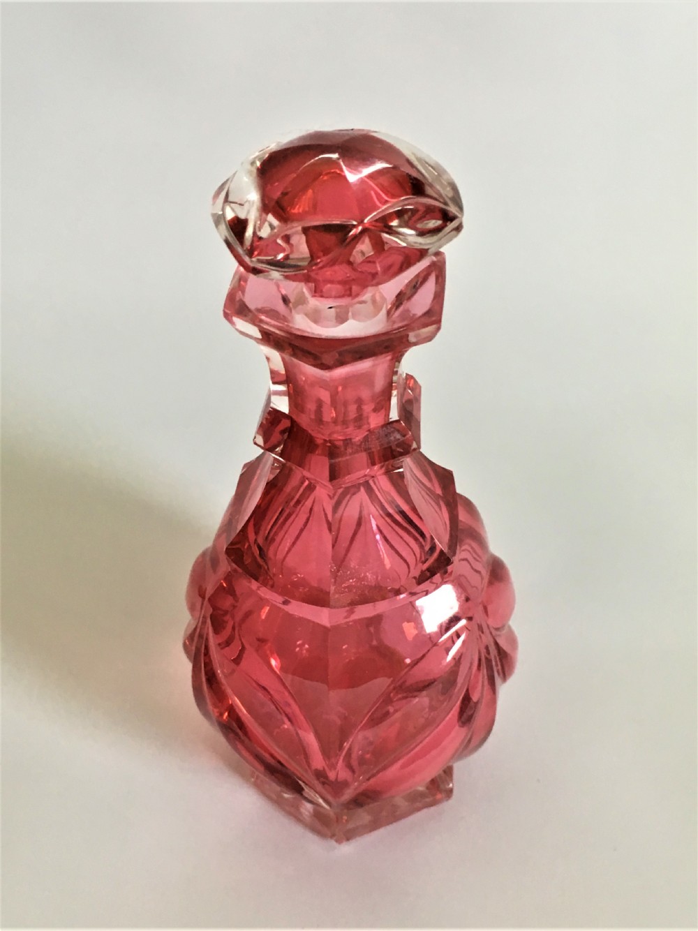 A Victorian cranberry gothic cut cologne bottle View II