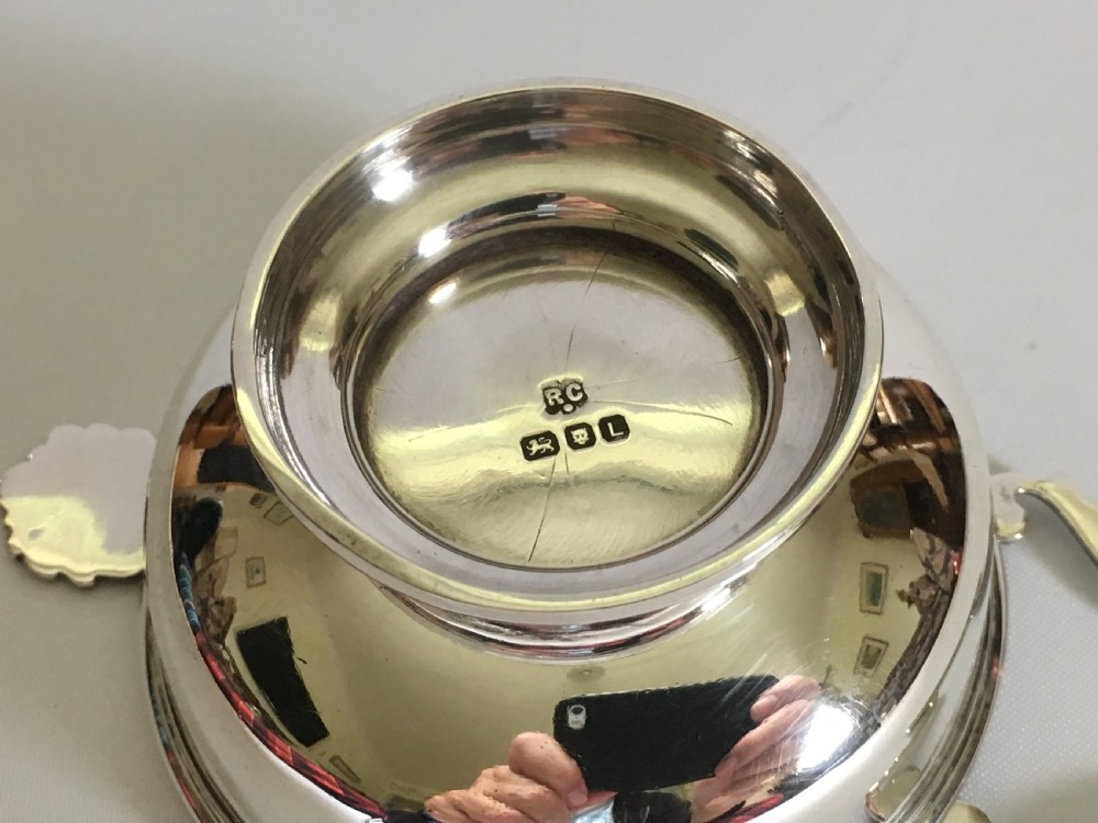  A William Comyns silver tea strainer & drip cup View VIII