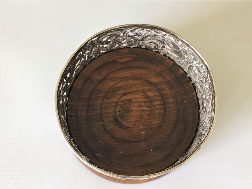 A fabulous William Comyns pierced silver wine bottle coaster View II