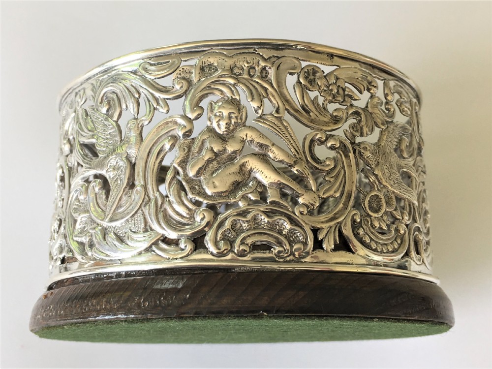 A fabulous William Comyns pierced silver wine bottle coaster View IV