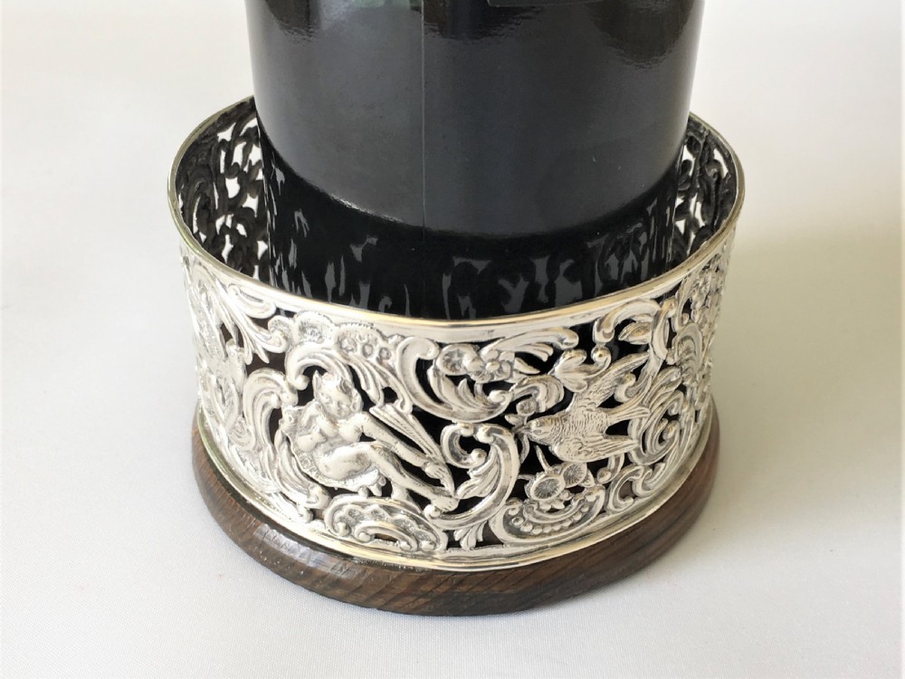 A fabulous William Comyns pierced silver wine bottle coaster View VI