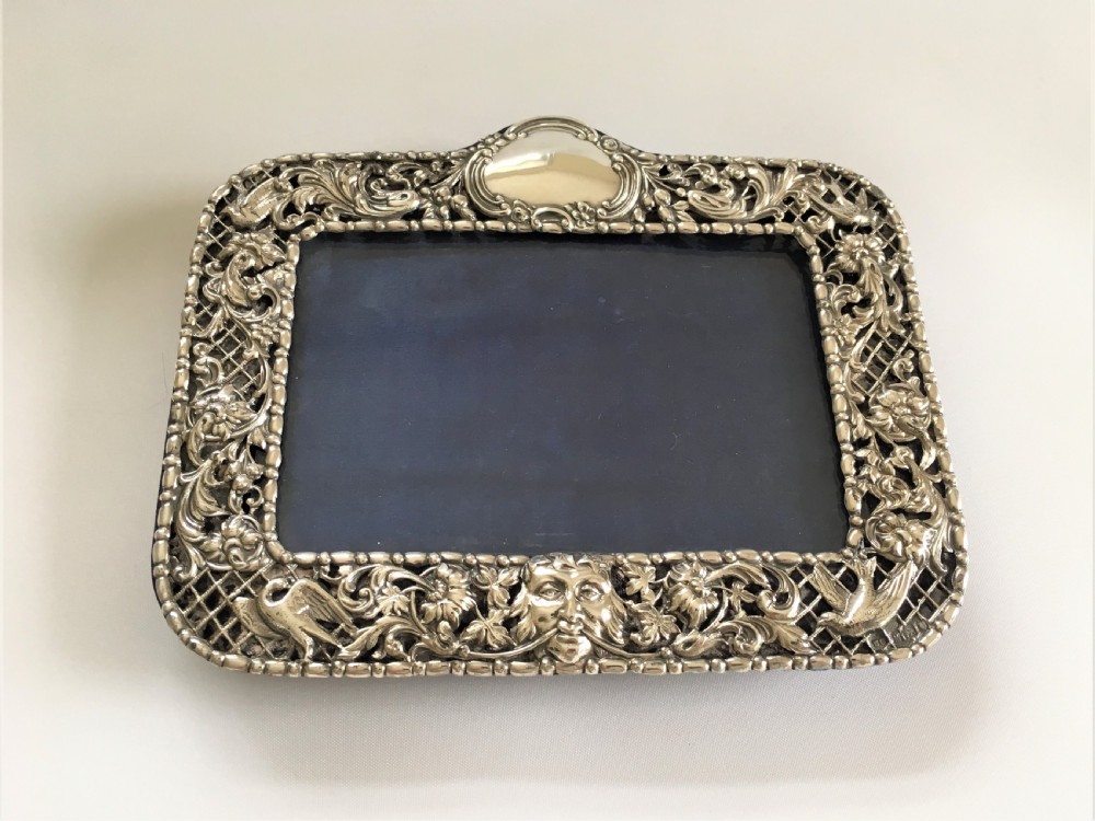 A superb pierced silver photo frame by William Comyns View IV