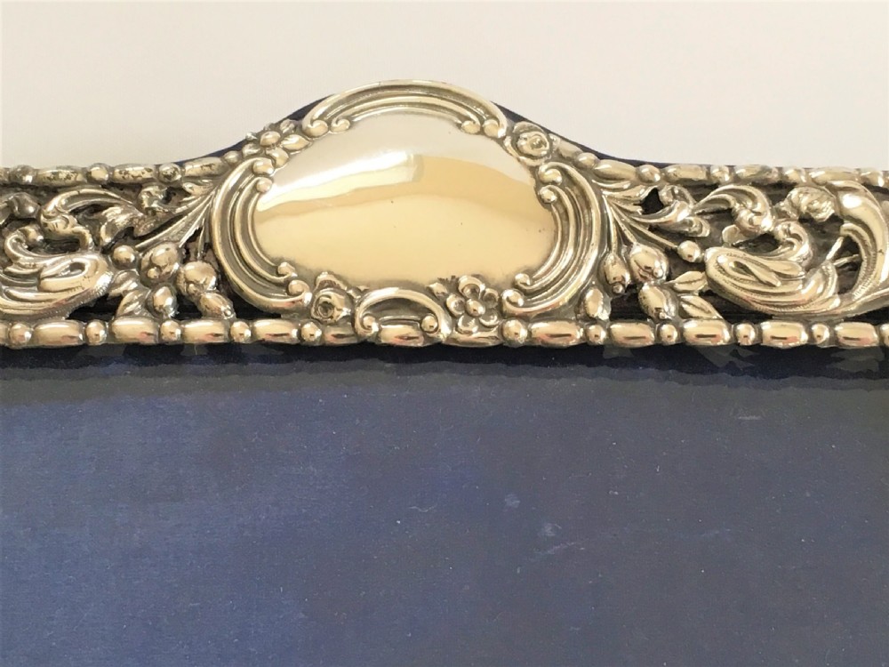 A superb pierced silver photo frame by William Comyns View VI