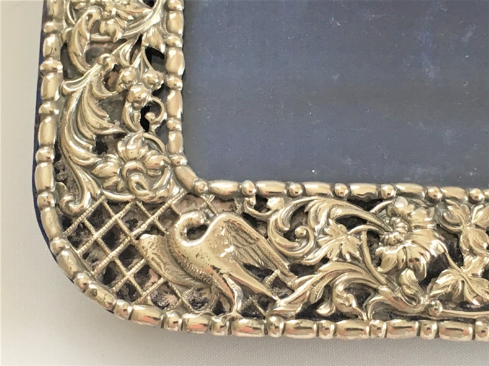 A superb pierced silver photo frame by William Comyns View VII