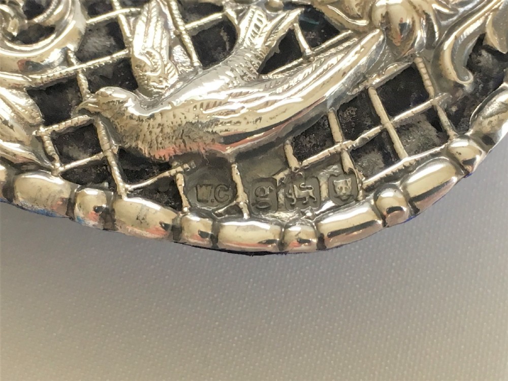 A superb pierced silver photo frame by William Comyns View VIII