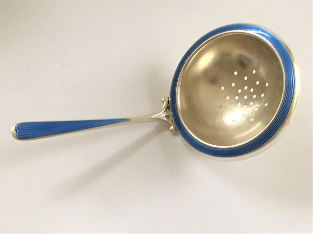 A Scandinavian silver & guilloche enamel tea strainer 