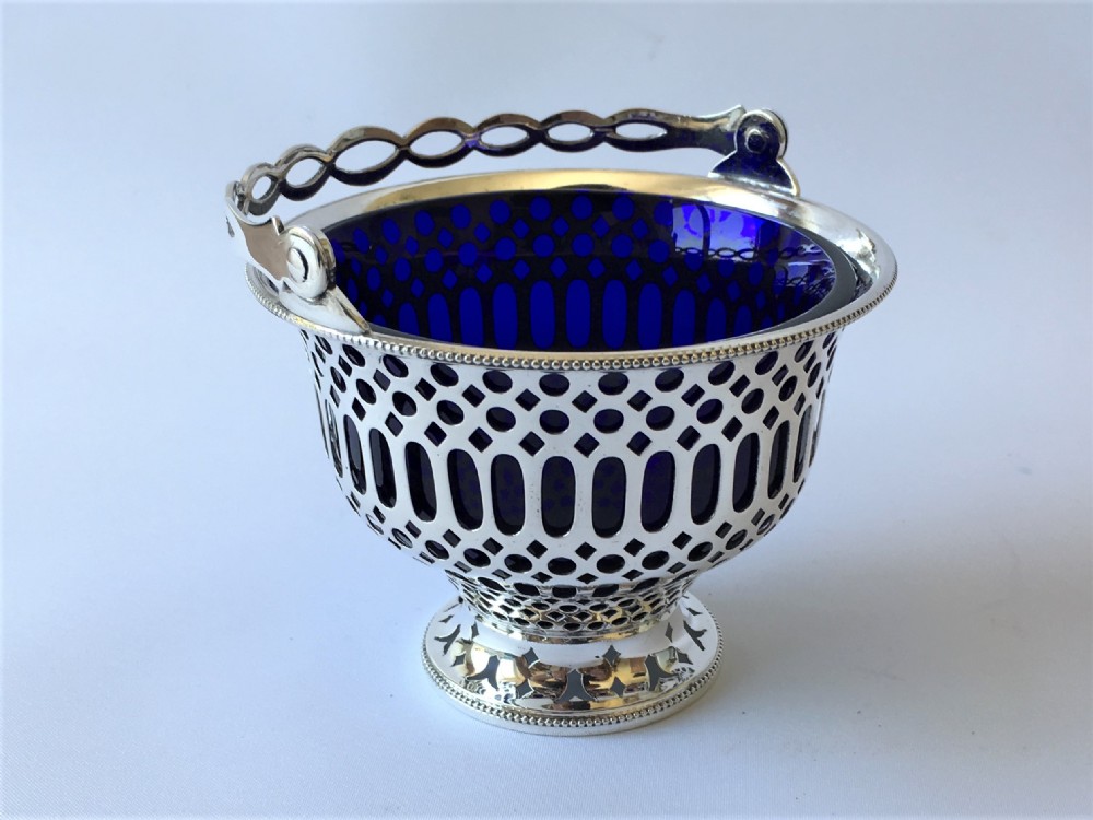 An Edwardian pierced silver swing handled bonbon basket View V