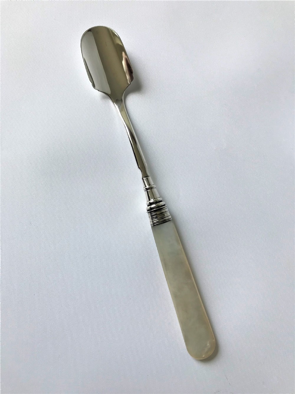 A rare Georgian silver & mother-of-pearl Stilton scoop View II