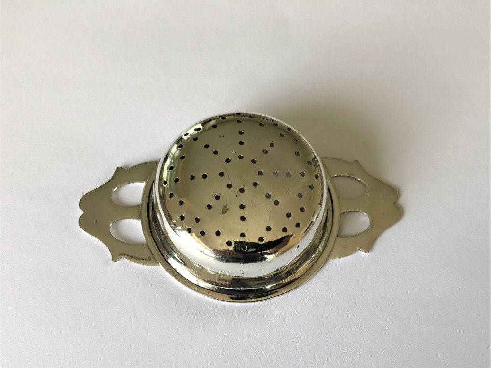 A stylish silver tea strainer in the Art Nouveau style View IV