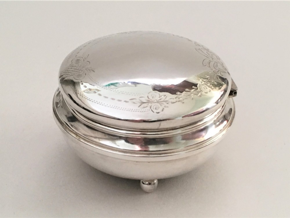 A pretty ribbon & flower engraved silver trinket box