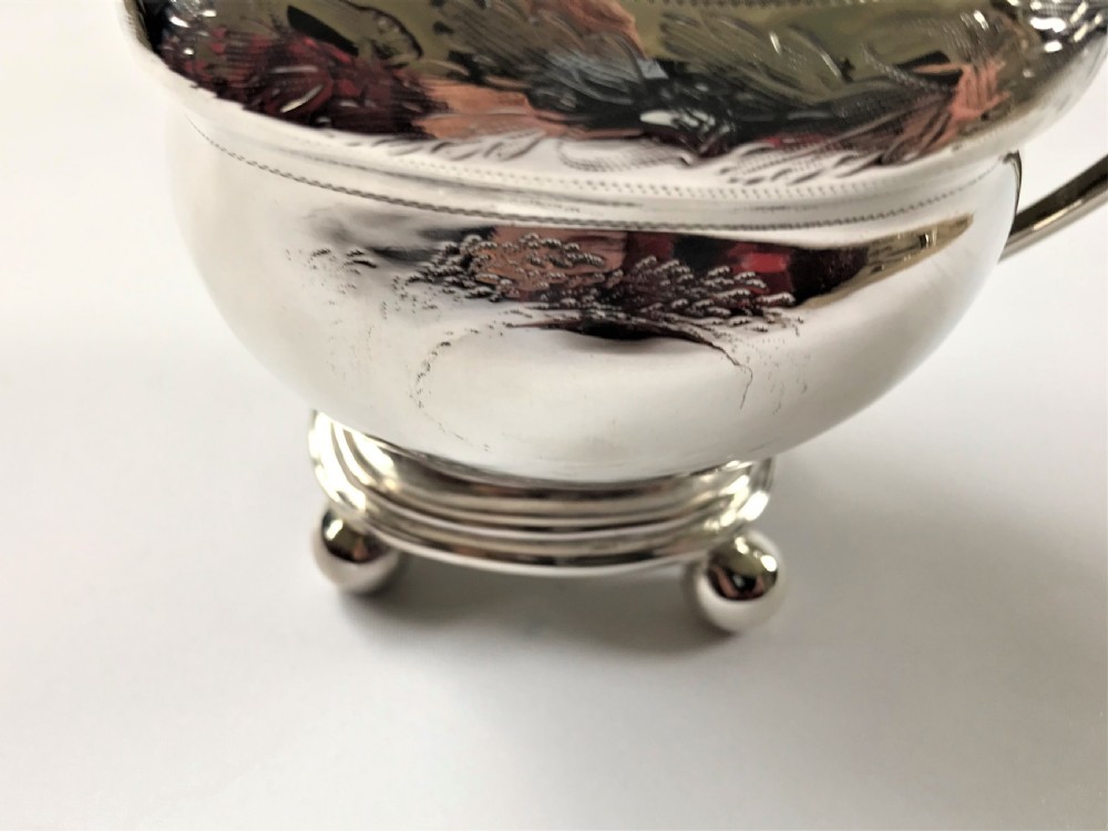 A Georgian Newcastle silver cream jug by a female silversmith View III