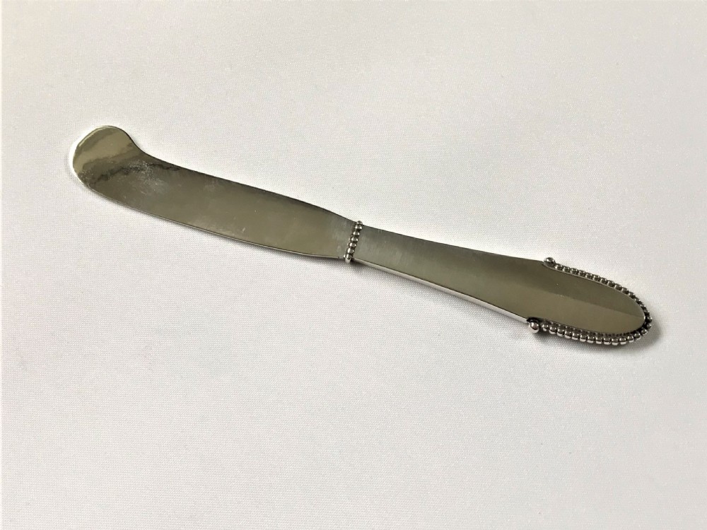 An Arts & Crafts Georg Jensen silver butterknife