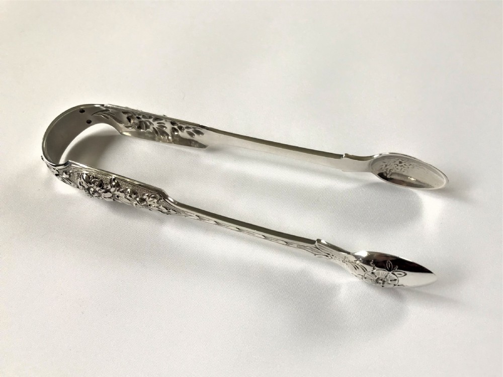 A fabulous pair of cast Irish silver tongs View II