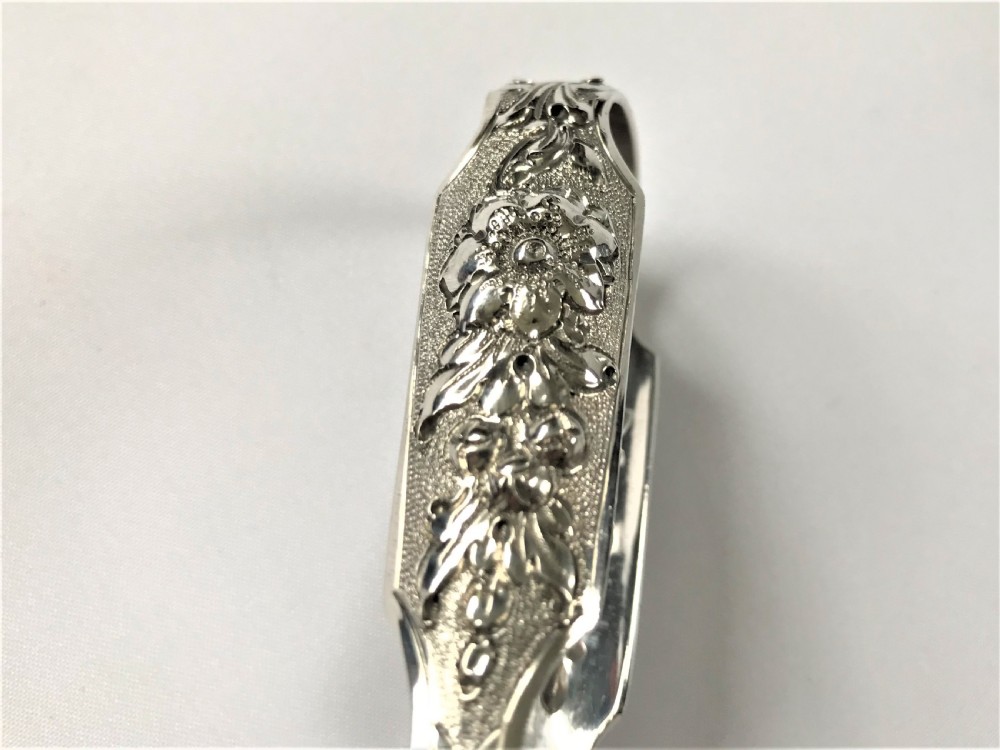 A fabulous pair of cast Irish silver tongs View IV