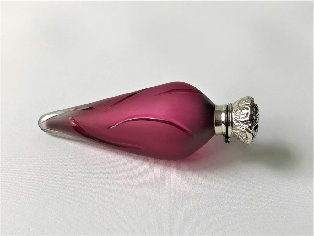 A rare Victorian silver mounted satin glass scent bottle