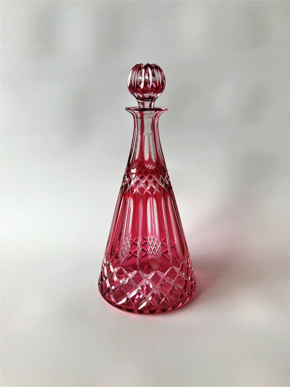 A lovely Victorian cranberry cut glass deanter