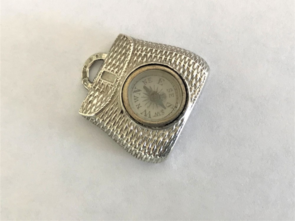 A rare Edwardian silver fishing interest 'creel' fob compass