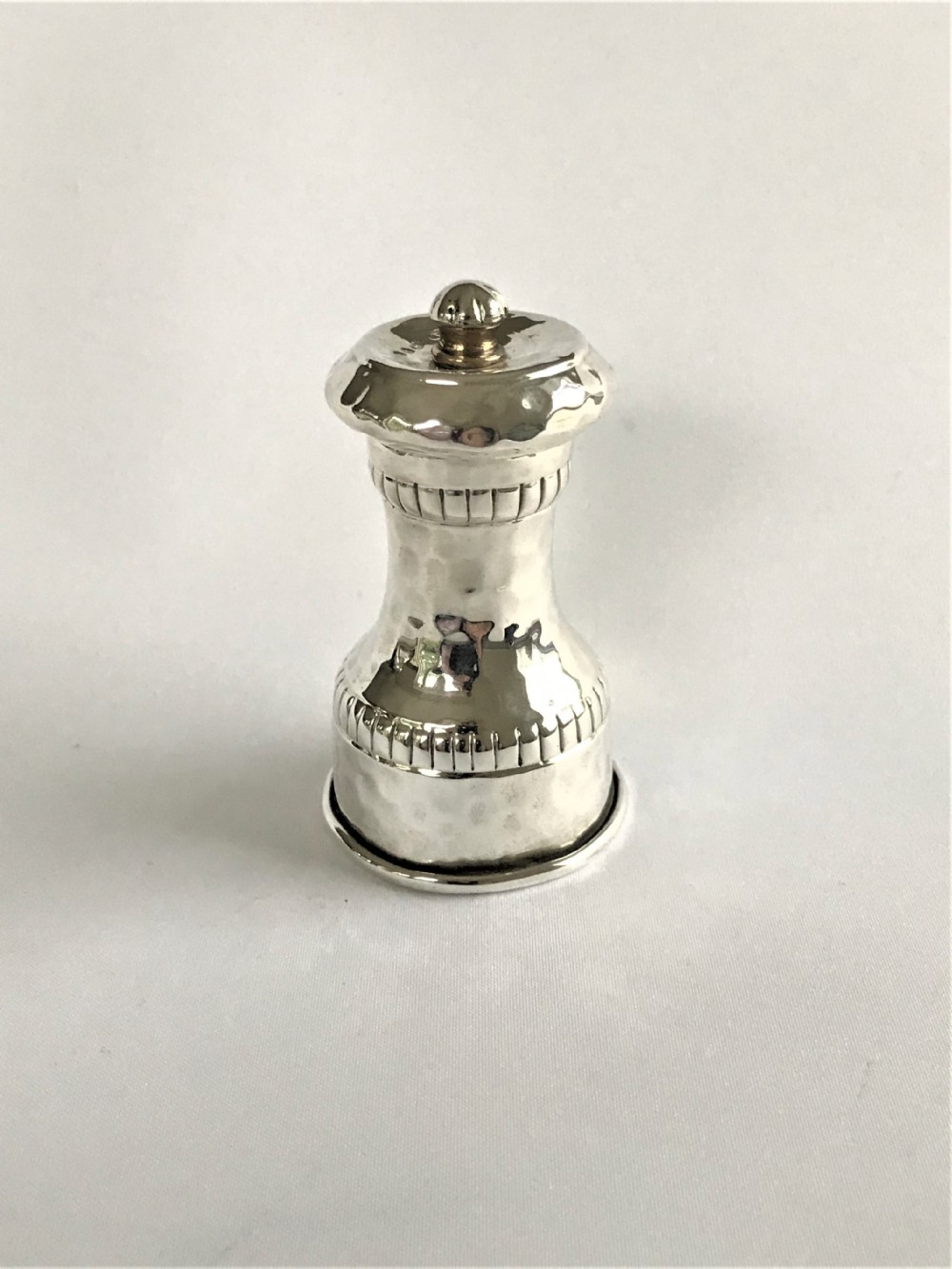 A superb Arts & Crafts silver pepper grinder