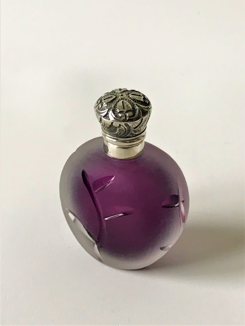A gorgeous Victorian silver mounted amethyst glass scent bottle